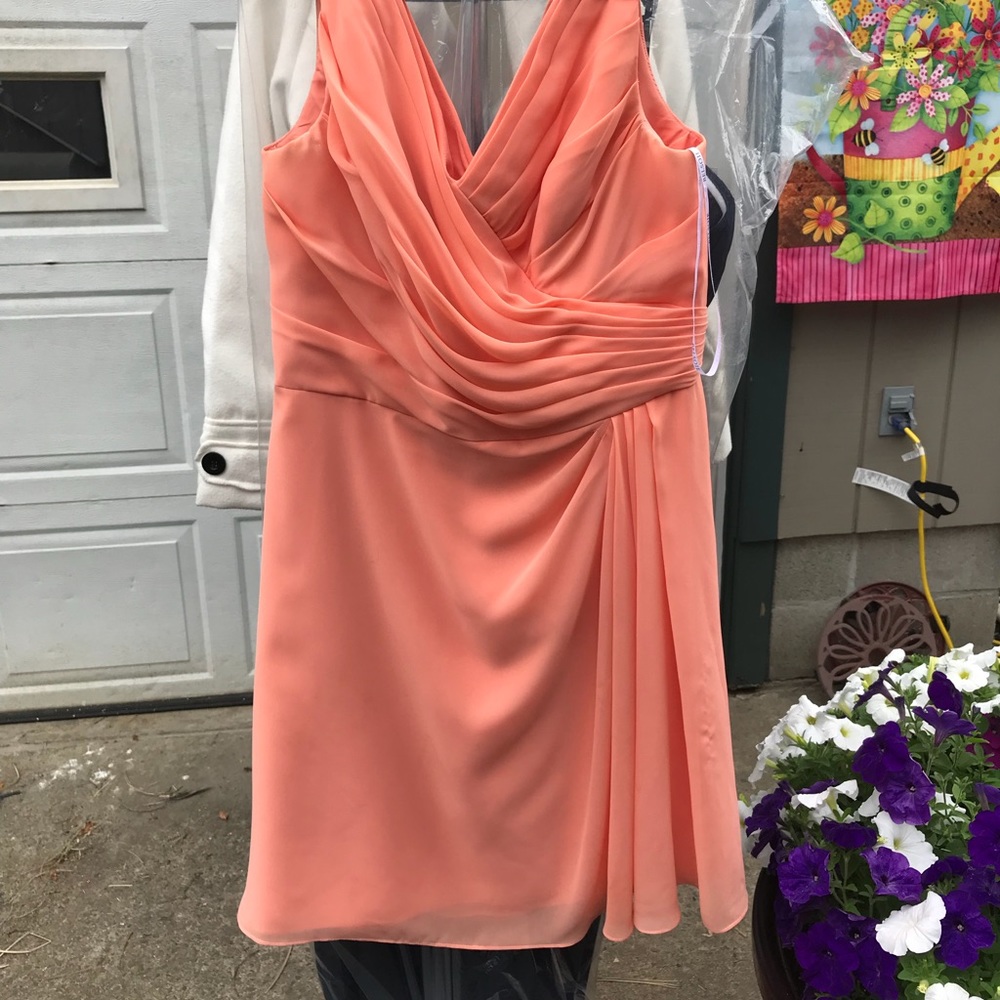 Coral rouched mid length bridesmaid dress